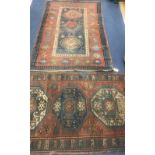 Two Caucasian red and blue ground rugs 210 x 130cm and 175 x 100cm. worn