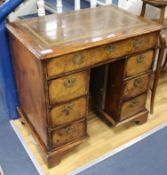 A George I style walnut kneehole desk W.81cm