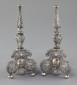 A pair of antique continental silver filigree and gem set bases, (ex-candlesticks?), with