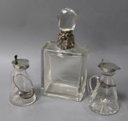 Two silver-mounted conical whisky noggins with spirit labels and a decanter, the noggins with star-