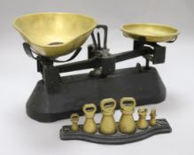 A set of Victorian brass and black painted cast iron scales and weights