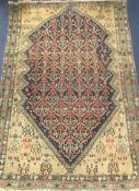 A Caucasian red, blue and cream ground rug 190 x 130cm.