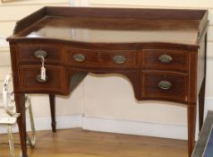 An Edwardian inlaid mahogany serpentine washstand W.107cm