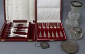 A small group of silver including two cased sets of pastry forks, a mounted glass vase and