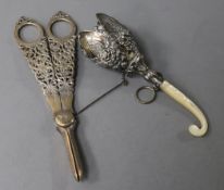 A pair of pierced silver grape scissors and a posy holder of pierced and embossed tulip design
