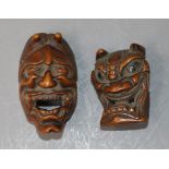 A Japanese Meiji carved wood Noh mask netsuke of Hannya and another similar
