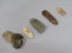 A prehistoric polished grey flint axe head, L 11cm and four other items, including a large Acheulean