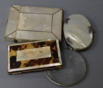 A 19th century tortoiseshell and ivory card case, two mother of pearl card cases and a silver