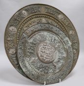 Two Himalayan Buddhist silver and brass circular plates