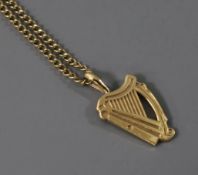A 9ct gold harp pendant on a 9ct gold chain.