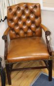 A mahogany framed leather button back 'Gainsborough' armchair