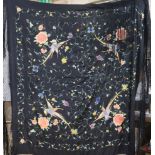 A Chinese embroidered silk shawl.