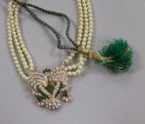 A triple strand cultured pearl necklace with yellow metal and paste set pendant, 42cm.