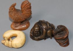 Four Japanese netsuke: one bronze, a cockerel, a dragon and figure on a gourd