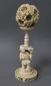 A Chinese ivory concentric ball on stand