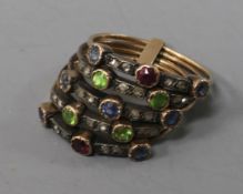 A gold five-section harem ring, multi gem-set with rubies, sapphires and peridots in alternating