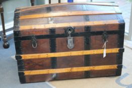 A wood and leather bound dome top steamer trunk W.92cm