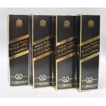 Four boxed bottles of Johnnie Walker Extra Special Black Label 12 year old whisky