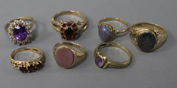 Seven assorted 9ct gold and gem set dress rings.