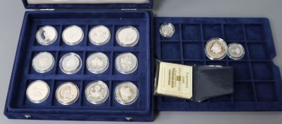 A cased collection of Royal Mint Queen Mother Commonwealth commemorative proof silver coins