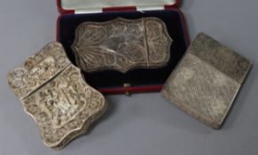 Three filigree card cases (unmarked), one Chinese, with dragon and phoenix decoration in high relief