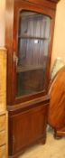 A 1930's walnut cupboard W.100cm