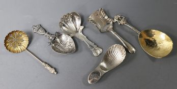 Three various 19th century silver caddy spoons, a modern parcel gilt spoon by Michael Allen Bolton