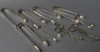 Six pairs of Georgian and late silver sugar tongs, a plated pair of tongs and two pairs of