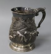A George III silver mug, later-embossed with a pastoral scene of sheep grazing, London 1762, Maker