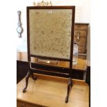 A mahogany firescreen inset with a Chinese embroidered silk panel W.54cm