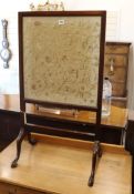 A mahogany firescreen inset with a Chinese embroidered silk panel W.54cm