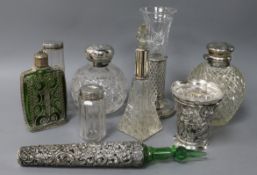 A collection of silver-mounted toilet jars, perfume flasks and flower vases, etc., including a