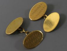 A pair of 9ct gold oval cufflinks.