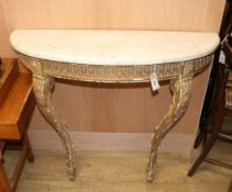 A marble-topped gilt console table.