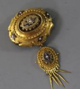A Victorian yellow metal, enamel and seed pearl set drop tassel brooch, overall 7cm.