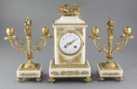 An early 20th century French marble clock garniture, the case and candlesticks with applied ormolu