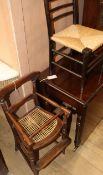 A late Victorian stained beech child's high chair and a child's rush seated ebonised chair