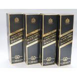 Four boxed bottles of Johnnie Walker Extra Special Black label 12 year old whisky