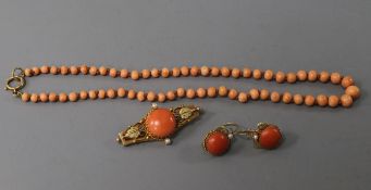 A continental yellow metal, coral and seed pearl brooch and pair of matching earrings and a coral