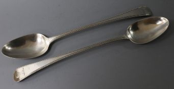 A pair of George III silver beaded Old English pattern basting spoons, Pratt & Humphries, London,