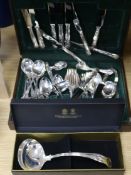 A canteen of plated Kings pattern cutlery and a soup ladle