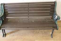 A wrought iron garden bench W.128cm