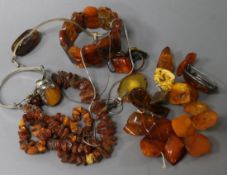 A small group of amber items, including bracelets, necklace, pendants and brooches.