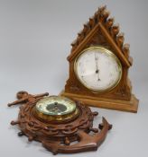 A walnut aneroid barometer and an anchor barometer