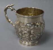 A George IV embossed silver christening mug, London, 1821.