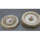 A collection of decorative plates, including a Derby plate, ten flower-decorated plates and six