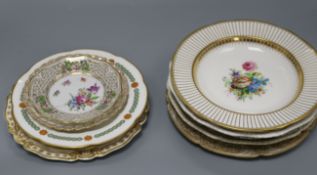 A collection of decorative plates, including a Derby plate, ten flower-decorated plates and six