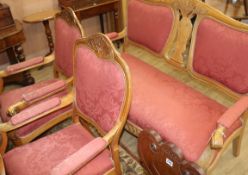 A continental carved beech three piece suite settee W.160cm