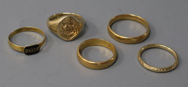 Five assorted rings including three wedding bands 22ct(2) & 9ct(1), a 9ct signet ring and a 19th