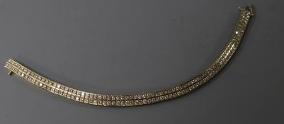 A modern 14ct gold and twin row diamond set line bracelet, with a total carat weight of 5.05cts,